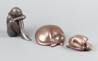 After D J Scaldwell, a bronzed figure of a reclining cat 10cm, 2 bronzed figures of crouching ladies 9cm and 4 cm 