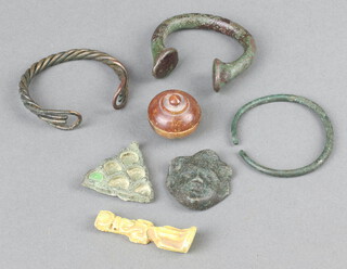 A bronze Roman amulet, 2 others and various curios