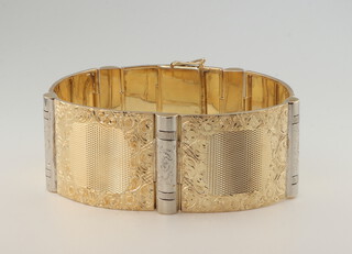 A yellow metal 585 engraved bracelet, 33 grams 