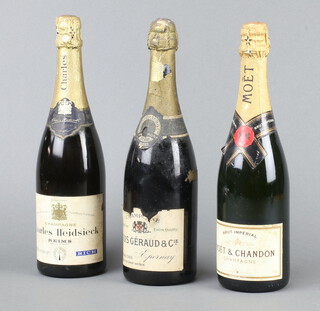 A bottle of 1928 Vintage Louis Geraud Cie Champagne, a bottle of Charles Heidsieck Champagne marked by Appointment to His Late Majesty King George VI and a bottle of Moet Chandon Champagne 