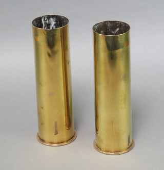 A pair of Continental brass shell cases 