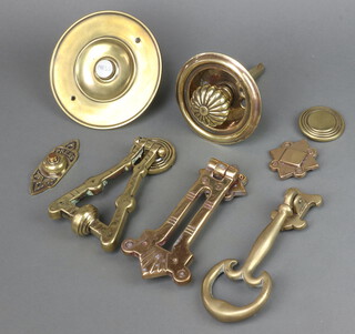 A brass bell pull 11cm, 3 brass door knockers and 2 bell presses 