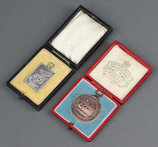 A National Sweet Pea Society silver medal cased, together with a bronze Life Saving Society medal cased