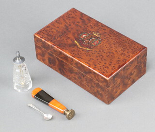 A rectangular figured walnut cigarette box with hinged lid decorated the Arms  of The Argyle and Sutherland Highlanders 6cm x 17cm x 10cm  containing a seal and a glass salt bottle 