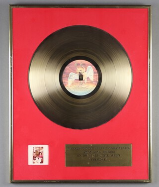 Led Zeppelin, a framed gold disc from Warner-Pioneer Japan, congratulating Swan Song Records in "On The Superlative Album Presence 1977" 