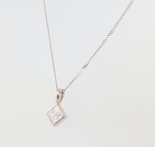 A white gold 4 stone diamond princess cut pendant, approx. 0.2ct on an 18ct chain 40cm, 2.6 grams 