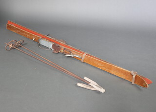 A pair of Kitzbuheler vintage wooden skis and poles 