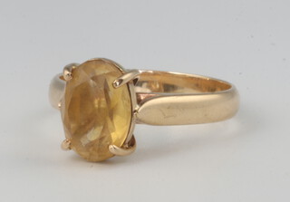 A yellow metal 375 dress ring with oval citrine size O, 3.4 grams