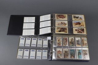 John Player and Sons cigarette cards, two binders of complete sets to include - Celebrated Gateways, Derby and Grand National Winners, Wild Animal Heads, Boy Scout and Girl Guide, Cries of London, Victoria Cross, Wrestling and Ju-Jitsu, Wonders of The World, Products of The World, Army Life, British Livestock, Characters From Thackeray, Polar Exploration, Characters From Dickens, Bygone Beauties, British Mammals, the Living Ocean, Britain's Endangered Wildlife, Britain's Wild Flowers, British Butterflies, Country Houses and Castles, History of The VC, Napoleonic Uniforms, Golden Age of Steam, Golden Age of Flying 