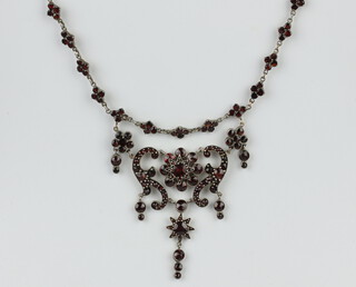 A Victorian gilt and garnet scroll necklace 