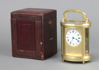 A 19/20th Century French 8 day carriage timepiece with circular 5cm dial, contained in an oval gilt metal case 11cm x 9cm x 7cm (no key)