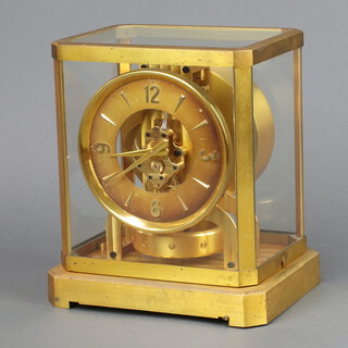 An Atmos clock no.74367 contained in a gilt and glass case 