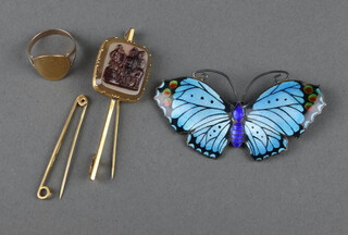 A yellow metal ring mounted with a 5 krona coin, size N, a 9ct gold bar brooch, gross weight 4.8 grams, an enamelled butterfly brooch and a gilt metal mounted intaglio pin 