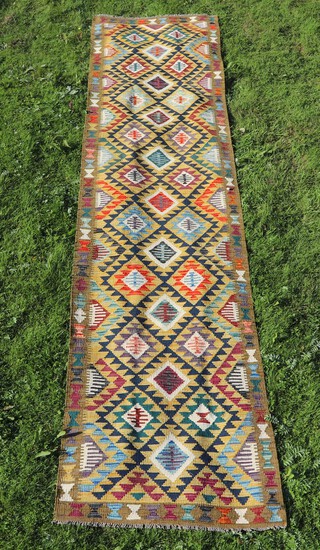 A green, black and tan ground Maimana Kilim runner 398cm x 91cm  