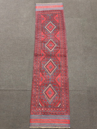 A red and white ground Meshwani runner with 4 diamonds to the centre 255cm x 60cm 