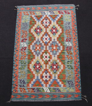 A white, green and turquoise ground Chobi Kilim rug with all over geometric design 160cm x 100cm 