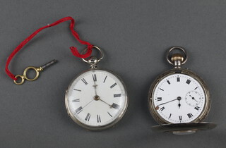 A silver cased half hunter pocket watch  contained in a 50mm case, a key wind pocket watch  Chester 1865 48cm (both not working) 