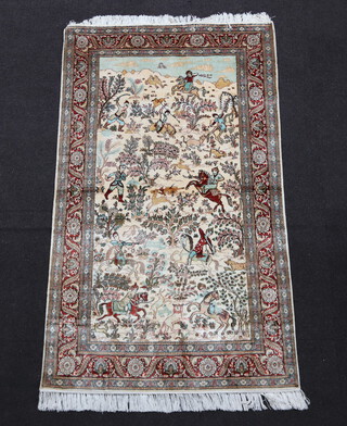 A white and brown ground Persian silk rug decorated a hunting scene 155cm x 90cm 