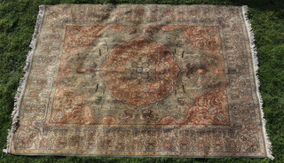 A green and brown grown Persian rug with central medallion, tree and animal decoration 377cm x 270cm 