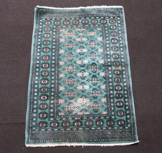 A green, black and white ground Bokhara rug, the central field with all over geometric design within a multi row border 143cm x 95cm 