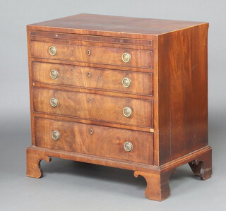 A Georgian mahogany chest with brushing slide above 4 long graduated drawers with replacement ring drop handles, raised on bracket feet 80cm h x 78cm w x 48cm d 