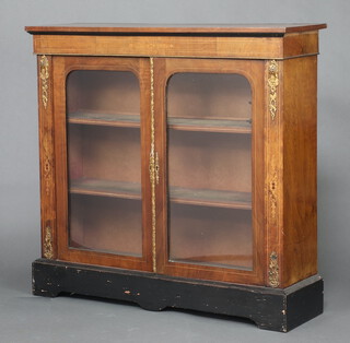 A Victorian inlaid walnut display cabinet, fitted shelves enclosed by arch panelled doors with gilt metal mounts  102cm h x 107cm w x 33cm d 