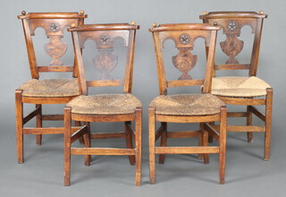 A set of 4 French 19th Century fruitwood bar back dining chairs with vase shaped slat backs and woven rush seats, raised on square supports 86cm h x 42cm w x 37cm d 