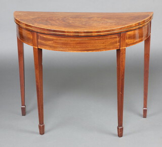 A Georgian inlaid and crossdbanded mahogany demi-lune card table, raised on square tapered supports, spade feet 74cm h x 92cm w x 46cm d 