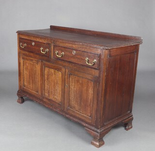 An 18th Century oak dresser base with raised back, fitted 2 drawers above cupboard enclosed by panelled doors, raised on bracket feet 96cm h x 137cm w x 55cm d 