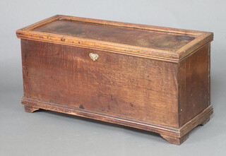 A rectangular oak coffer constructed of old timber with hinged lid, dummy brass escutcheon to the front, raised on bracket feet 57cm h x 117cm w x 46cm d 