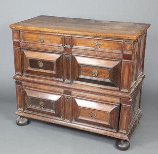 An 18th Century oak chest with geometric mouldings and fitted 3 long drawers, raised on bun feet (in 2 sections) 95cm h x 108cm w x 52cm 