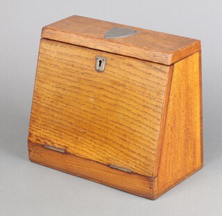 An Edwardian light oak wedge shaped stationery box with fitted interior and writing slope to the front, 20cm h x 24cm w x 13cm d 