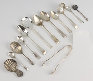 A Georgian silver caddy spoon with shell bowl, rubbed marks and minor cutlery 156 grams 