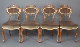 A set of 4 Victorian walnut show frame dining chairs with upholstered seats and backs, raised on cabriole supports 85cm h x 45cm w x 40cm d (seats 20cm x 26cm) 