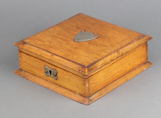 A Victorian square oak trinket box with silver plated shield to the top, hinged lid, 7cm h x 22cm w x 22cm d 