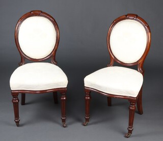 A pair of Victorian mahogany show frame balloon back dining chairs with upholstered seats and backs, raised on turned and fluted supports 93cm h x 38cm w x 47cm d (seats 28cm x 24cm)  