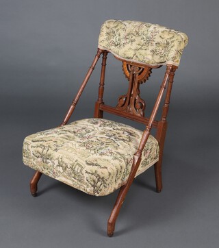 A Victorian carved and pierced mahogany hall chair, the seat and back upholstered in tapestry material 70cm h x 47cm w x 46cm d (seat x 30cm x 33cm) 