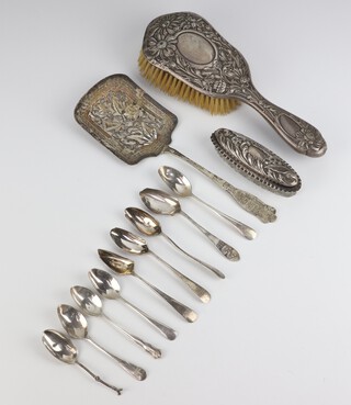 An Edwardian silver backed hair brush Birmingham 1905, a mounted dressing table pot, minor spoons and a server, weighable silver 147 grams 