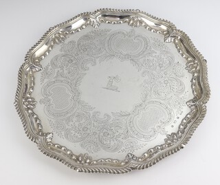 An Edwardian engraved silver salver with acanthus rim, engraved scrolls and armorial, Birmingham 1900, maker Elkington & Co. Ltd., 1266 grams, 37cm 