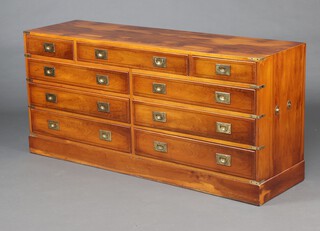 A yew military style chest of 7 long and 2 short drawers with handles to the side, raised on a platform base 70cm h x 150cm w x 48cm d 