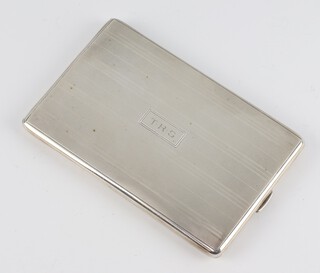 A Sterling silver engraved rectangular silver cigarette case with monogram, 135 grams 