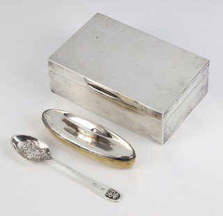 A silver cigarette box Birmingham 1927, 14cm, a mounted nail buffer and spoon 