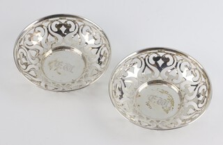 A pair of Edwardian circular pierced silver dishes with engraved monogram Chester 1908, 11cm, 98 grams 