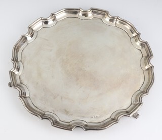 A Georgian style silver salver with Chippendale rim on scroll feet Birmingham 1945, 31cm, 797 grams 