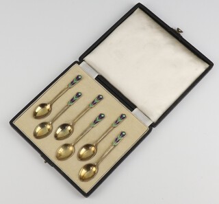 A set of 6 silver gilt and enamelled coffee spoons Birmingham 1975, 59 grams, cased 