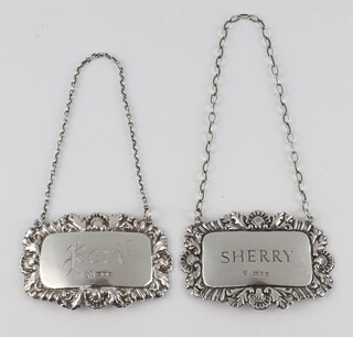 A pair of repousse silver spirit labels - port and sherry, London 1985, 26 grams