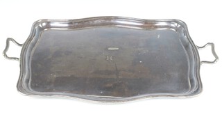 A silver plated 2 handled serpentine tray with engraved monogram 72cm 