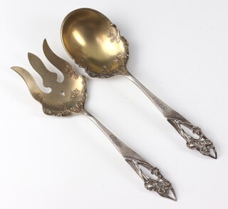 A pair of Sterling silver servers with pierced floral handles, 213 grams, maker Shreeve and Co. with engraved monogram 