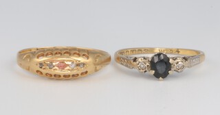 An 18ct yellow gold 4 (ex 5) stone gem set ring, size N and a ditto sapphire and diamond ring size K, gross weight 4 grams 