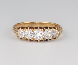 A yellow gold 18ct 5 stone diamond ring approx. 1.2ct, 3.1 grams, size O 1/2